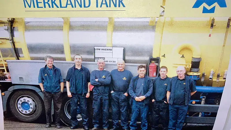 about merkland tank - photo of team in front of tanker