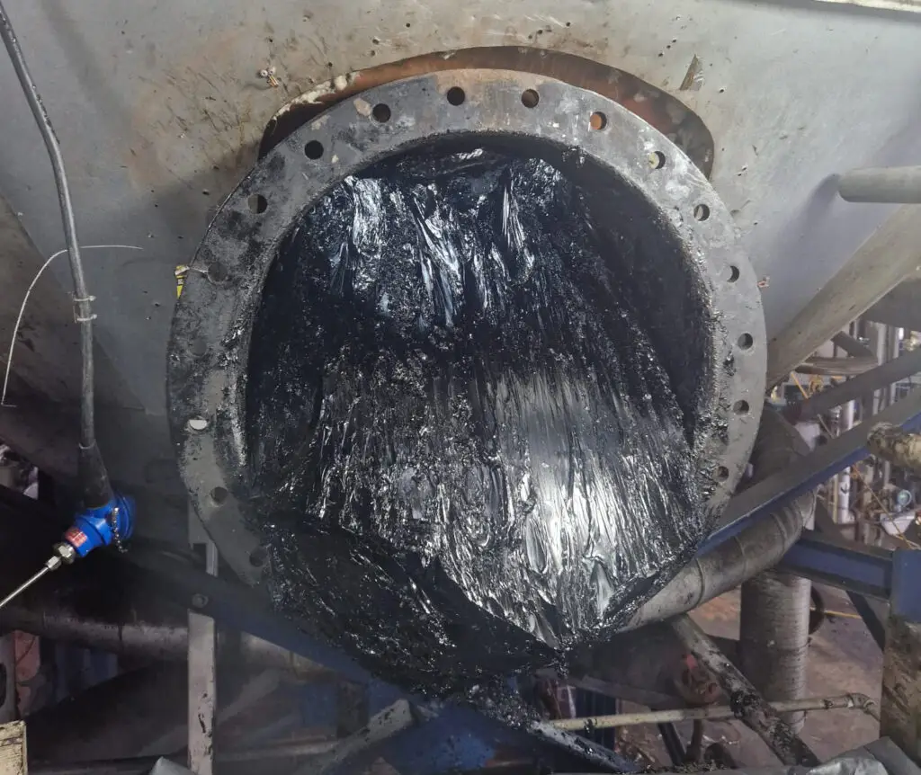 Merkland Tank manway buildup cleaning